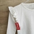 REMERA PLUMETI JUANITA VOLADO