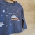 REMERA UNIVERSE DINO - NATURAL