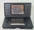 Console DS Lite Preto com carregador com detalhe na internet
