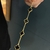 PULSEIRA TREVO - PEDRAS PRETAS - Versa Joias
