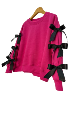 33904 Buzo Fucsia Con Moños en internet