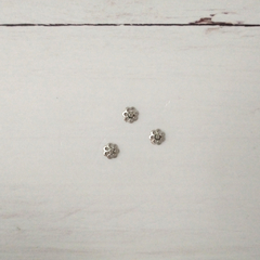 Calotas flor de 6 mm x 100 uni. - comprar online