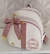 Mochila maternidade média Off wite com Rosê - comprar online