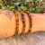Pulseira de Olho de Tigre Lapidada 4mm - Coragem - loja online