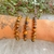 Pulseira de Olho de Tigre Lapidada 8mm - Coragem na internet