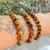 Pulseira de Olho de Tigre Lapidada 8mm - Coragem - loja online