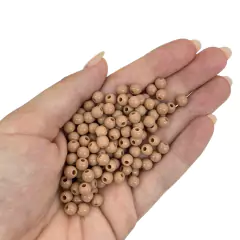 MIÇANGA PULSEIRA BOLA MARROM ESCURO - 6MM - 20 GRAMAS na internet