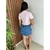 Mini Saia Jeans Claro Barra Desfiado - Crisconf-Vestuários e Acessórios