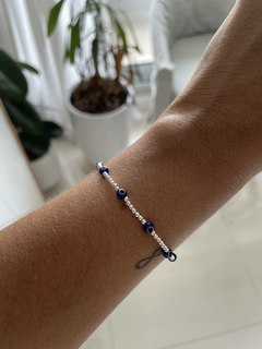 Pulsera elastica ojitos azules