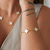 Pulseira 5 Trevos Branco - Banhado a Ouro 18K - comprar online