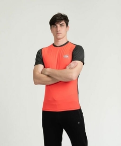 REMERA VAPODRI TRAINING PRETORIA NARANJA Y NEGRO CANTERBURY