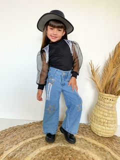 Conjunto Boiadeira Ana Castela calça jeans +blusa tule