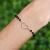 Pulseira com Miçanga Preta e Coração