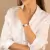 Woman wearing Square Bronx Rose Gold Women's Watch with leather strap