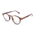 Óculos de grau redondo masculino modelo Mira Tortoise Giorno com armação em acetato padrão tartaruga.