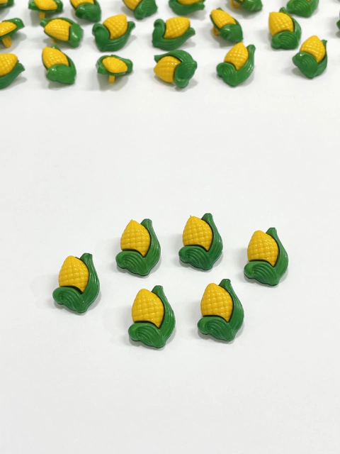 Aplique/botão milho P junino plástico - 4 unidades