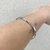 Imagem do Bracelete Torcido No Meio Aro Aberto Banhado No Ouro/Ródio - PL263