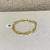 Bracelete Torcido Fino Prata/Dourado - PL995 - LAURA ASSUNÇÃO SEMIJOIAS 