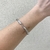 Bracelete Torcido No Meio Aro Aberto Banhado No Ouro/Ródio - PL263 - LAURA ASSUNÇÃO SEMIJOIAS 