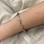 Bracelete Torcido Fino Prata/Dourado - PL995 - comprar online