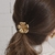 Gominha De Cabelo Com Flor de Metal Dourada Com Miolo De Strass - PS304