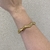 Bracelete Ondulado Prata/Dourado - PL1301 na internet