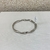 Bracelete Torcido Fino Prata/Dourado - PL995 na internet