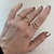 Anel Meia Aliança Zig Zag Cravejada de Zircônias Banhada No Ouro - AN1334 - LAURA ASSUNÇÃO SEMIJOIAS 