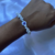 Pulseira de Olho Grego e Pedra Howlita - Sorte, Proteção e Serenidade na internet
