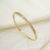 Bracelete Rígido Ajustável Dourado com Detalhe Cravejado - comprar online