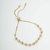 Pulseira Dourada com detalhes em bolinhas, regulável, banhada a ouro 18K na internet