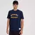 Camiseta New Balance Greatest Hits Ringer na cor azul marinho, com estampa amarela "NEW BALANCE ATHLETIC DEPT."