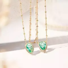 ESCAPULARIO GOTA TURMALINA PARAIBA ZIRCONIA DOURADO na internet