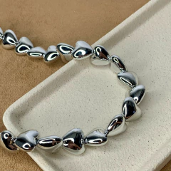 COLAR POLIDO CORAÇÕES - Carlota Acessórios