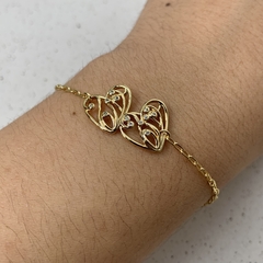 PULSEIRA 2 CORAÇÕES DESENHADO VAZADO PONTO ZIRCÔNIA DOURADO - comprar online