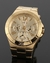 Reloj Guess con malla de acero dorado