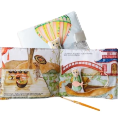 LIBRO SENSORIAL DE TELA "NINA VIAJA EN GLOBO" - tienda online