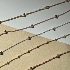 PULSERA CORDON CON BOLITAS en internet