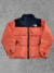 Campera The North Face Bordada Nuptse Naranja SKU J86 *