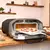 Forno de Pizza Elétrico Portátil Ooni VOLT 12 - 110V - UU-P12700 - loja online
