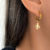 Argollas Travel acero dorado (par)