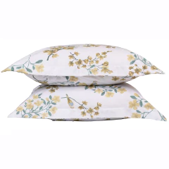 Fronhas de percal 100% algodão com estampa floral em tons de amarelo e verde.
