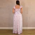 Vestido longo feminino com estampa de borboletas em tons rosa e lilás, visto por trás, com decote quadrado e mangas curtas franzidas