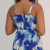 Vista traseira de vestido longo azul com estampa floral em tons de azul e branco, com alças finas, modelo Giovana Max Flor Azul