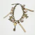 Pulsera Dorada con Dijes color