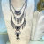 Collar metal triple flechas - comprar online