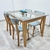 MESA EN PARAISO CON TAPA DE VIDRIO 10MM Y 4 SILLAS NÓRDICAS