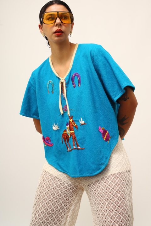 Poncho cavalo bordado azul