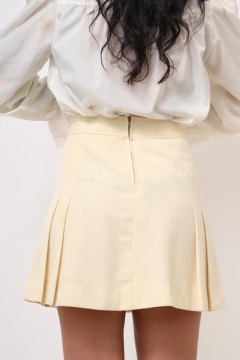 Imagem do Saia creme cintura alta mini