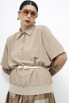 Blusa poa bege golinha punho na internet